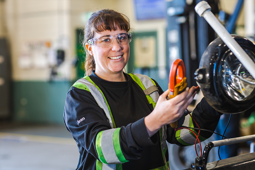 Female employee performing maintenance